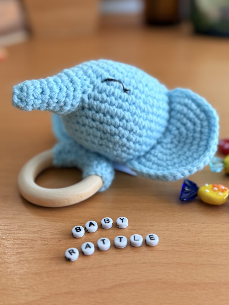 handmade crochet blue elephant baby rattle with soft ears and gentle sound