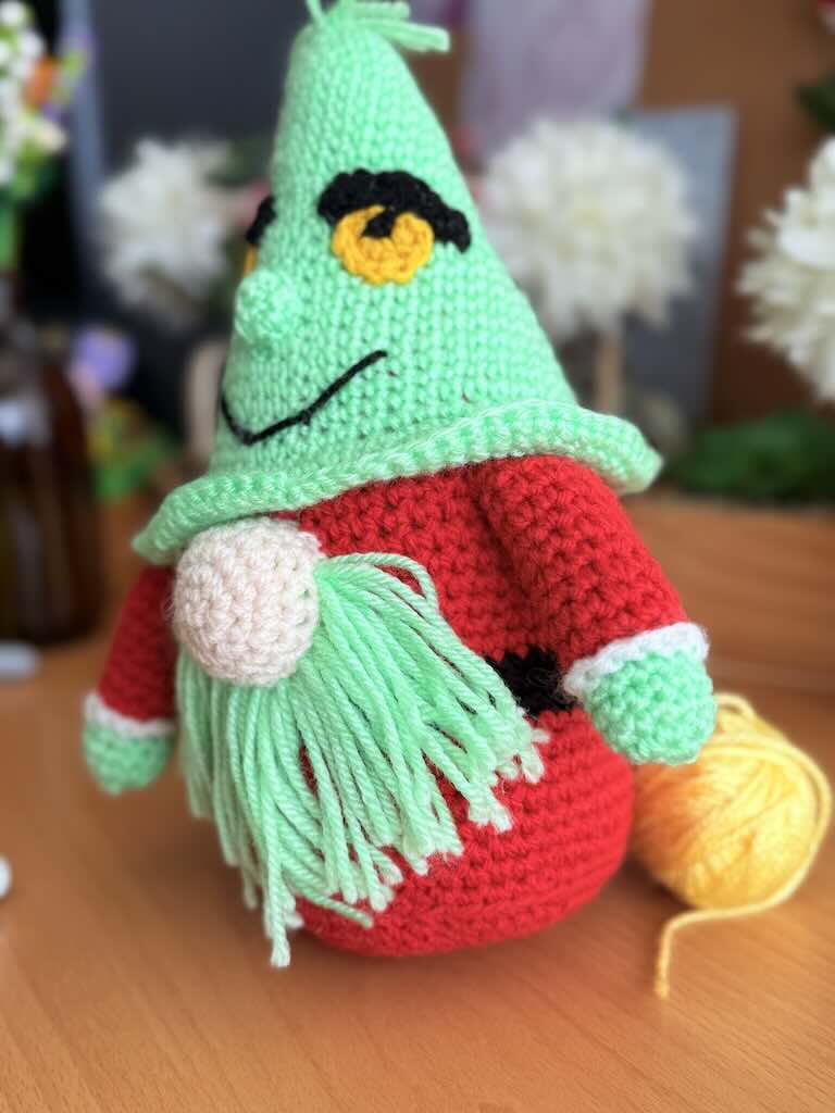 handmade crochet Grinch Santa gnome with green hat and red body