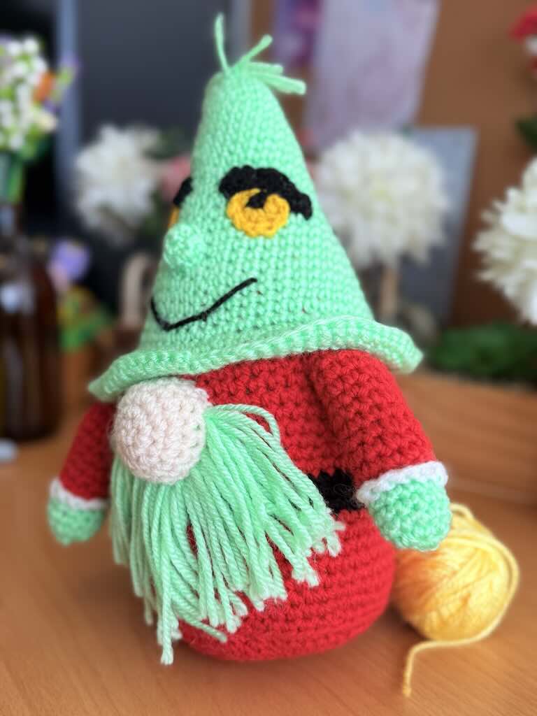 handmade crochet Grinch Santa gnome with green hat and red body