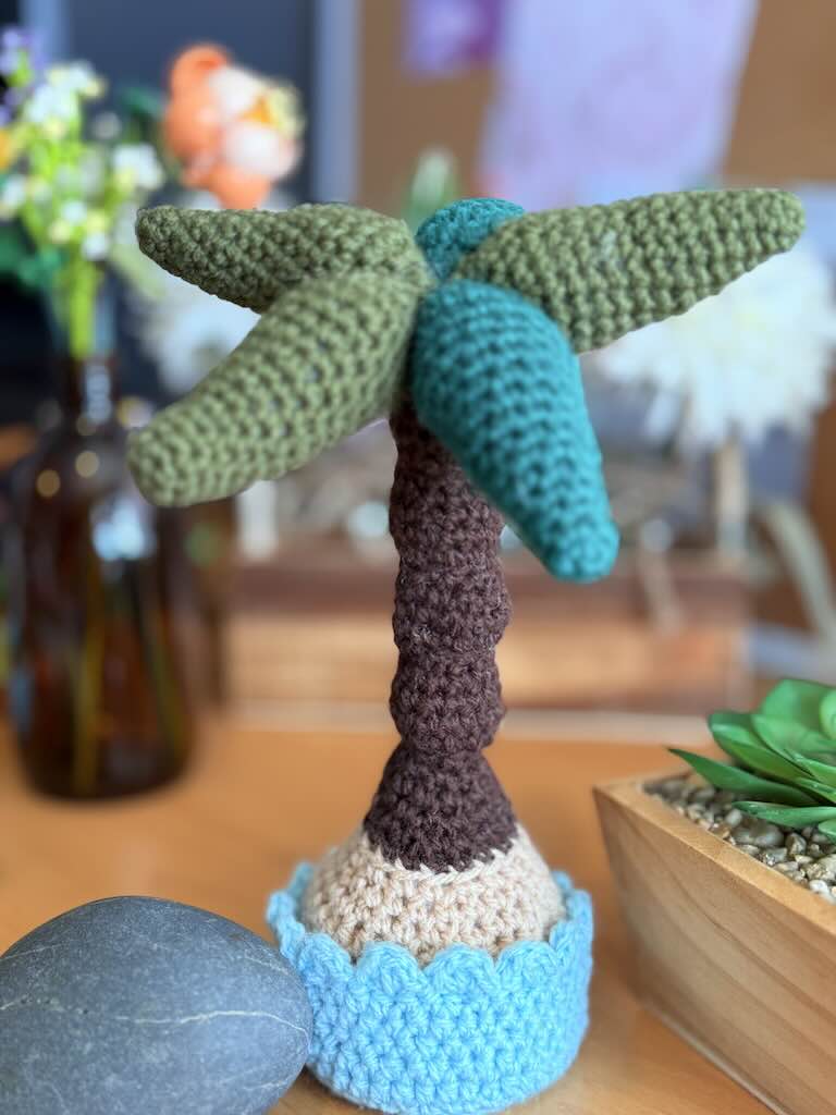 crochet potted palm tree with green leaves and brown trunk