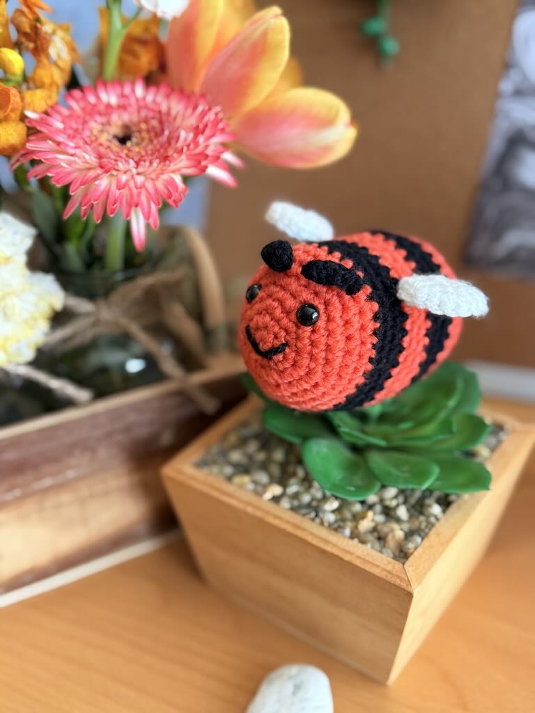 handmade crochet little bee with bright orange and black stripes