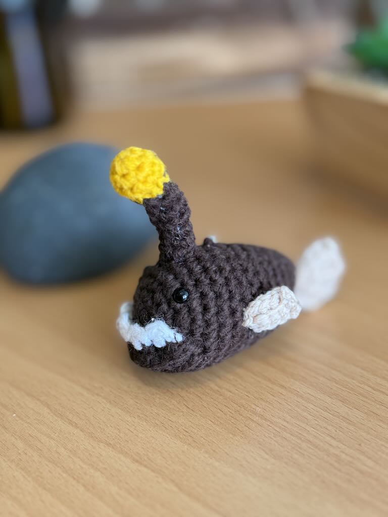 keychain crochet anglerfish toy with small light lure and dark body