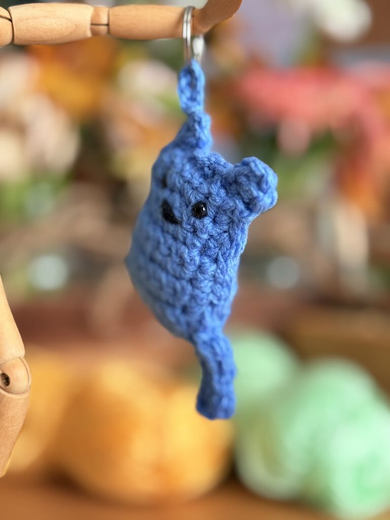 handmade keychain crochet blue cat with playful expression