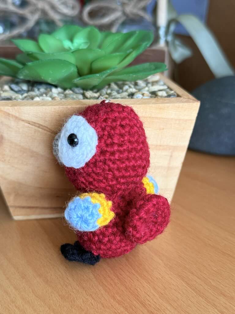 keychain crochet parrot toy with bright, colorful feathers