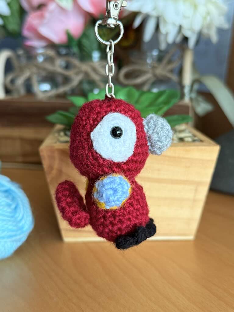 keychain crochet parrot toy with bright, colorful feathers