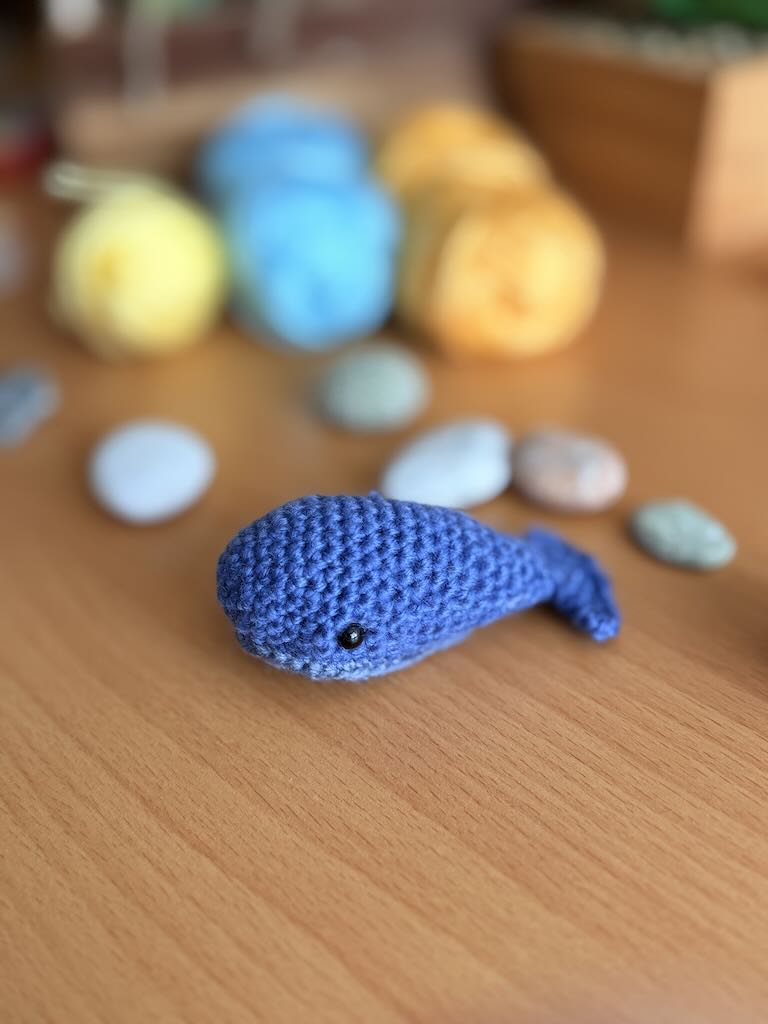 handmade crochet mini whale with blue body and light belly