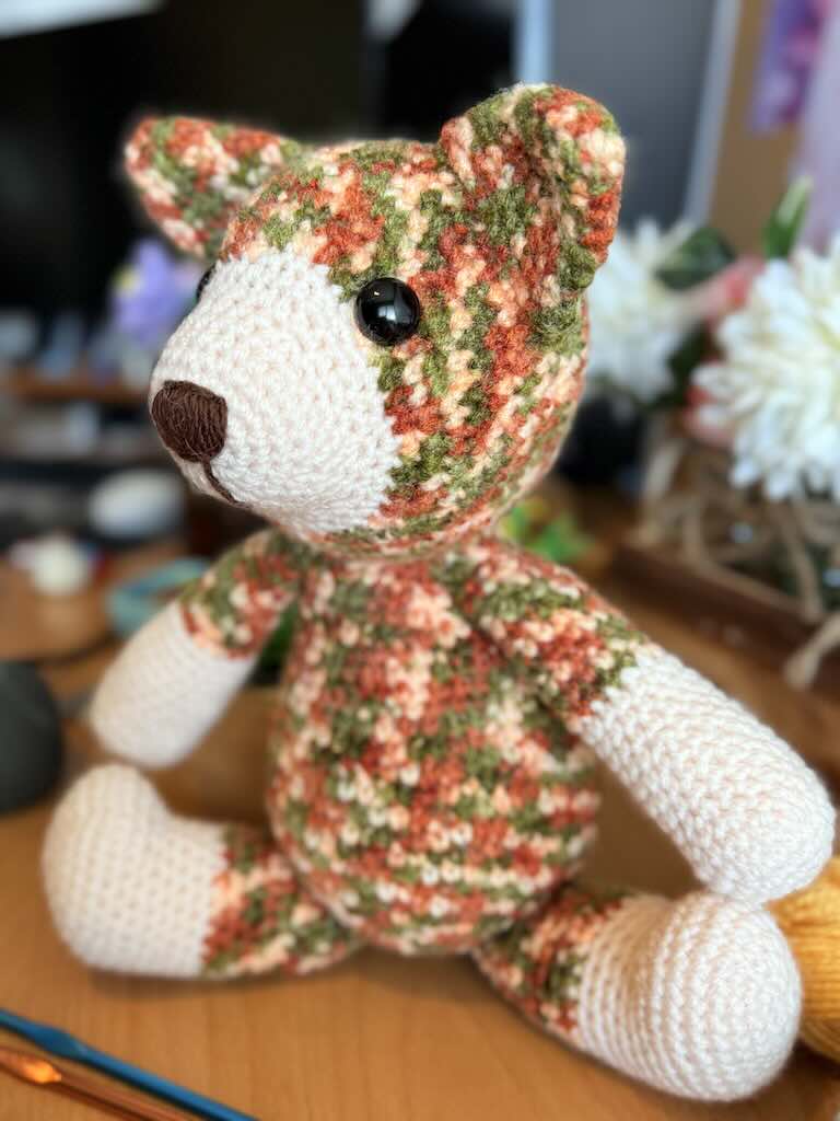 handmade colorful crochet cat named Cory with playful expression