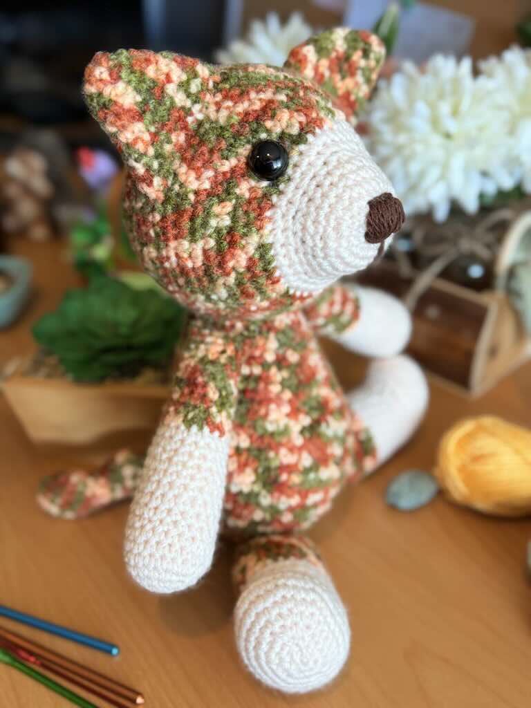 handmade colorful crochet cat named Cory with playful expression
