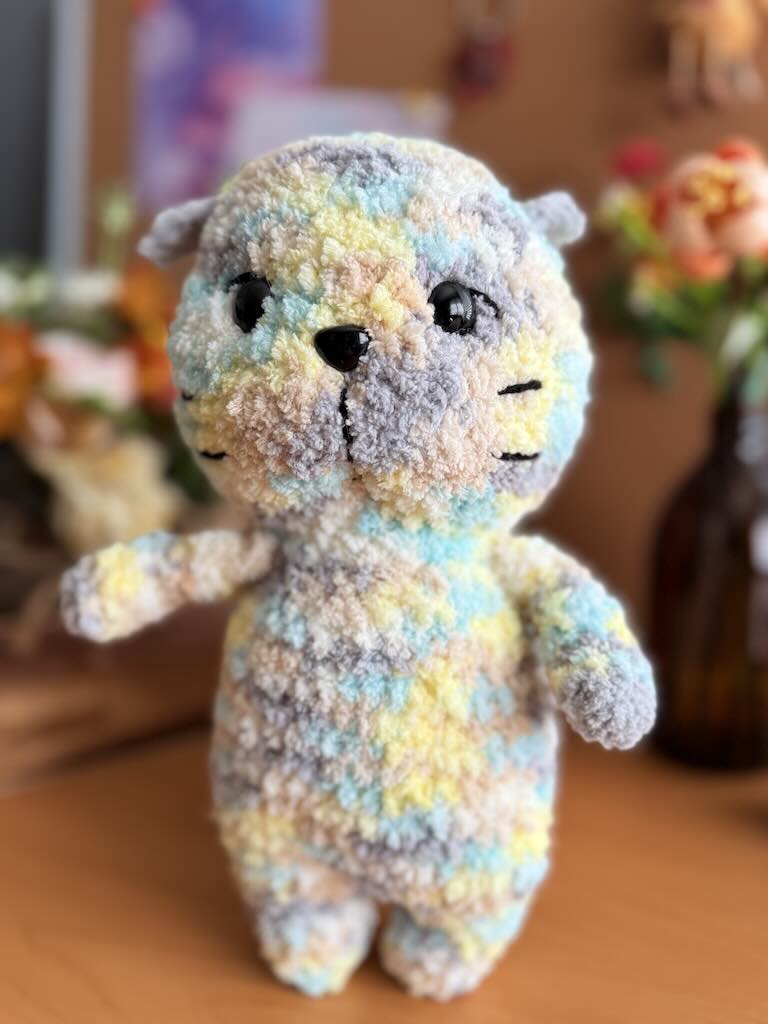 handmade crochet cat named Cuddles with soft yarn and friendly face