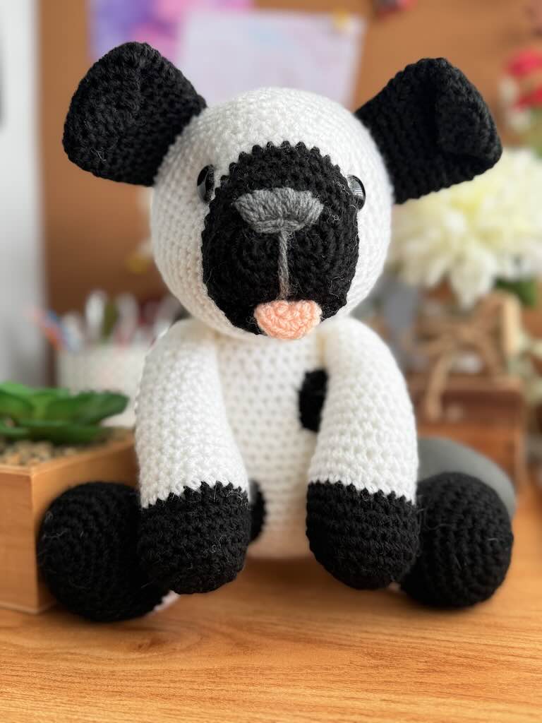 crochet dalmatian dog toy named Dot with black spots and cute face