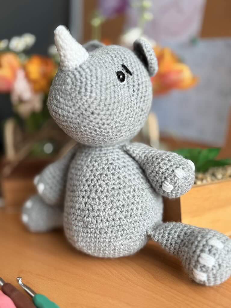 handmade crochet rhino toy named Roxi with soft horn and sturdy body
