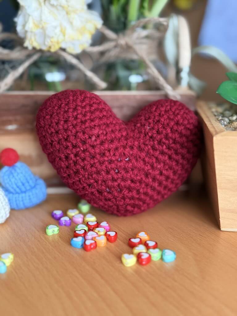 handmade crochet dark red heart with rich yarn and soft finish
