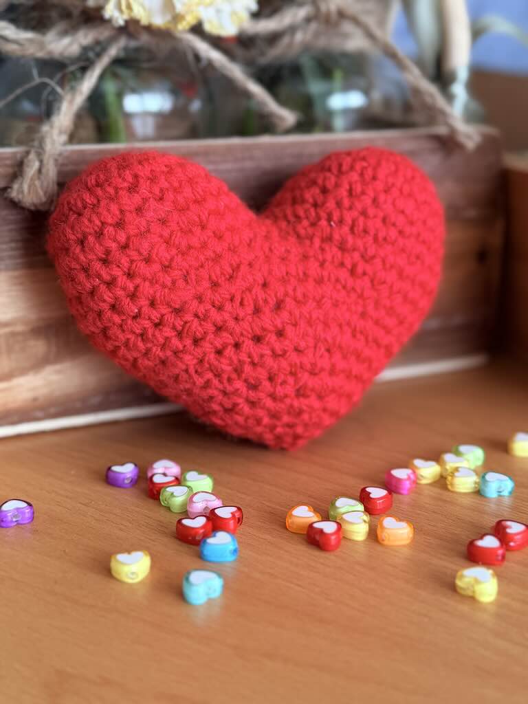 handmade crochet red heart plush symbolizing love and warmth