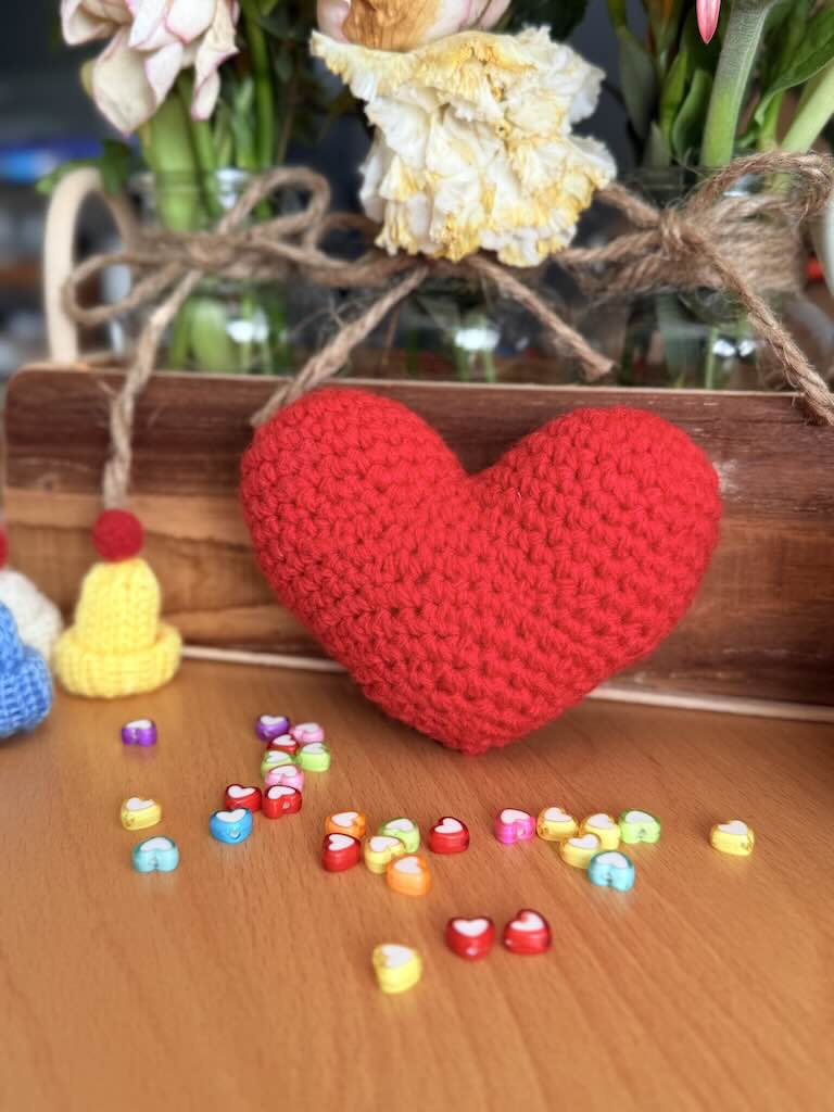 handmade crochet red heart plush symbolizing love and warmth
