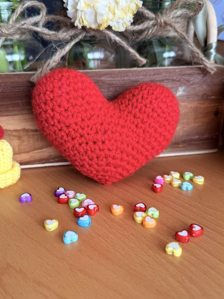 handmade crochet red heart plush symbolizing love and warmth