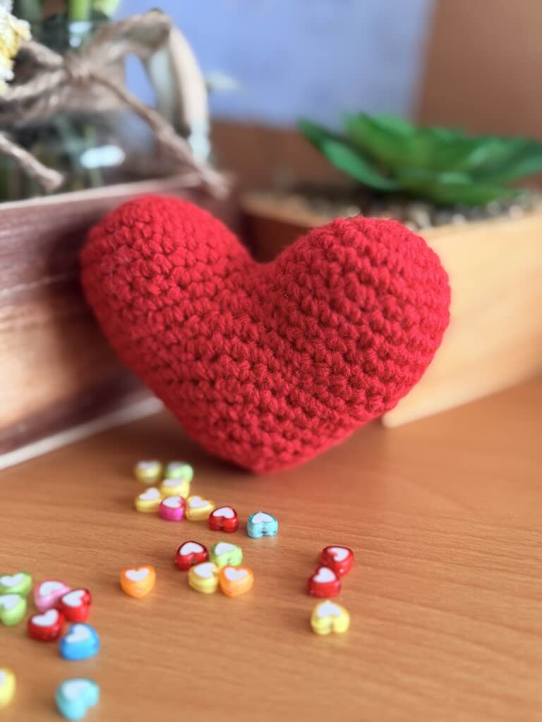 handmade crochet red heart plush symbolizing love and warmth