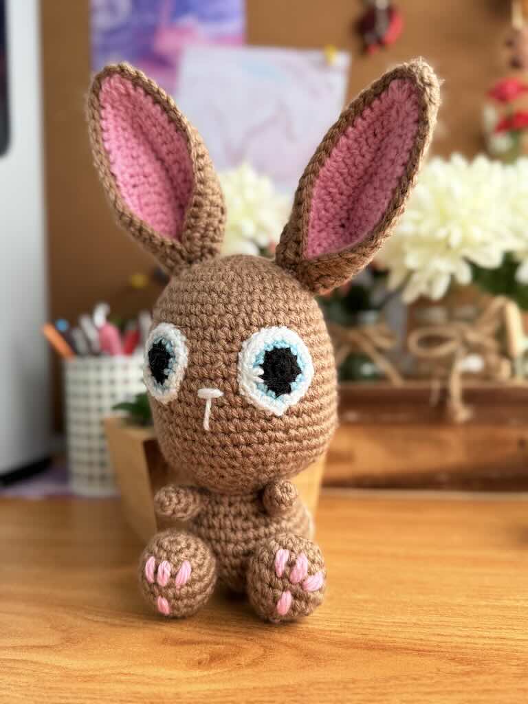 handmade crochet bunny toy named Flopsy with floppy ears and big eyes