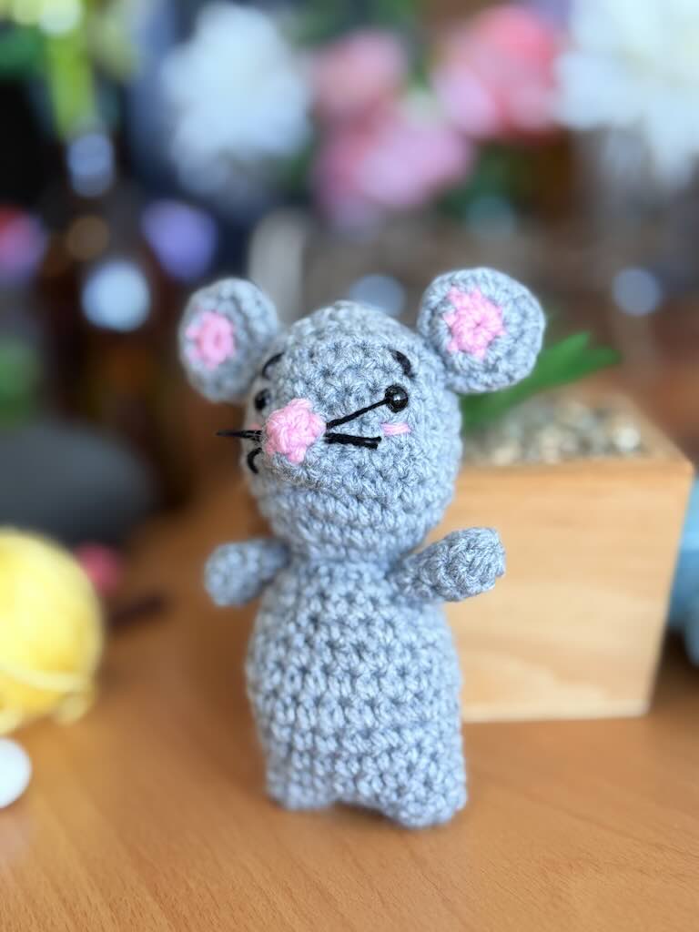 handmade crochet mouse toy named Minki with pink ears and nose
