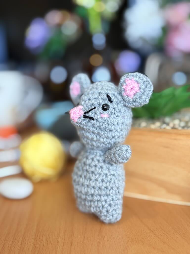 handmade crochet mouse toy named Minki with pink ears and nose