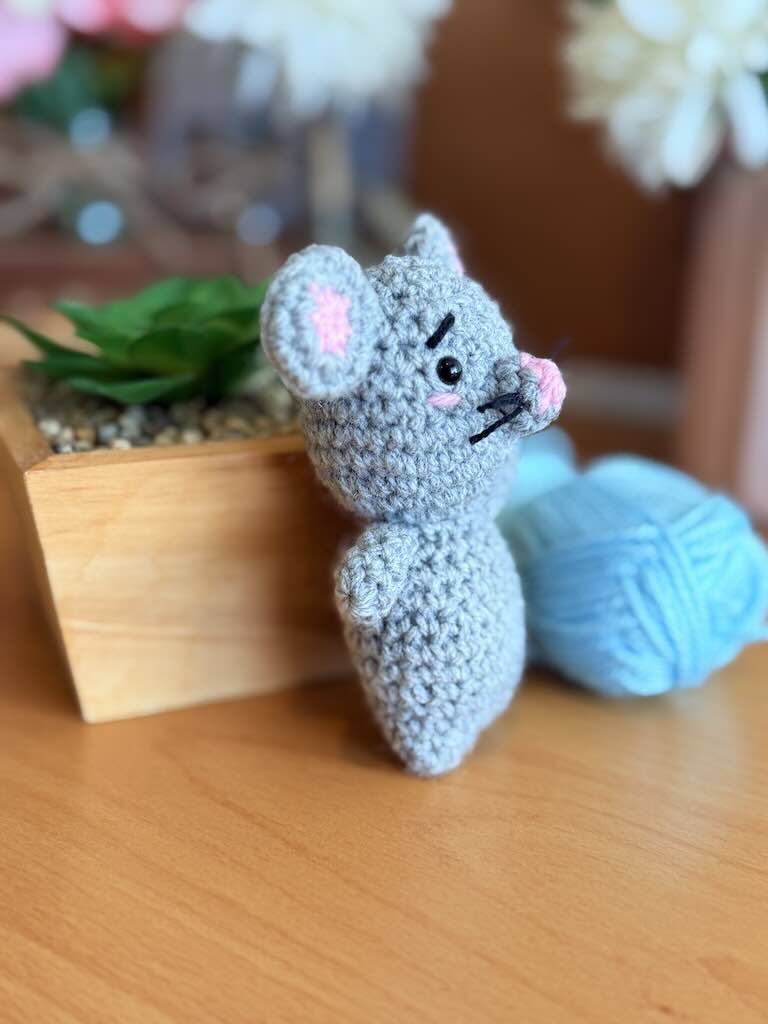 handmade crochet mouse toy named Minki with pink ears and nose