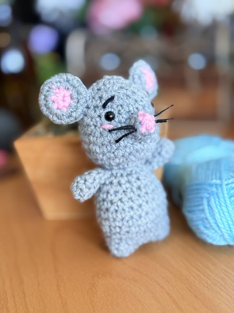 handmade crochet mouse toy named Minki with pink ears and nose