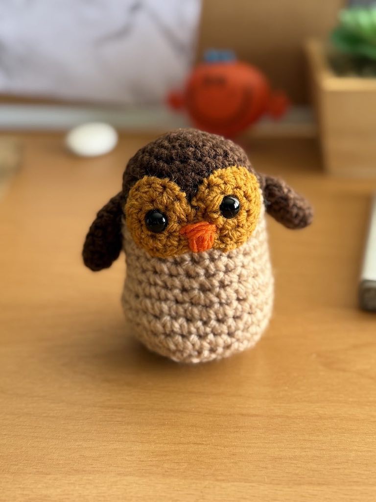 handmade crochet owl toy named Ollie with big eyes and soft feathers