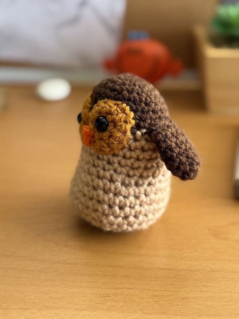 handmade crochet owl toy named Ollie with big eyes and soft feathers