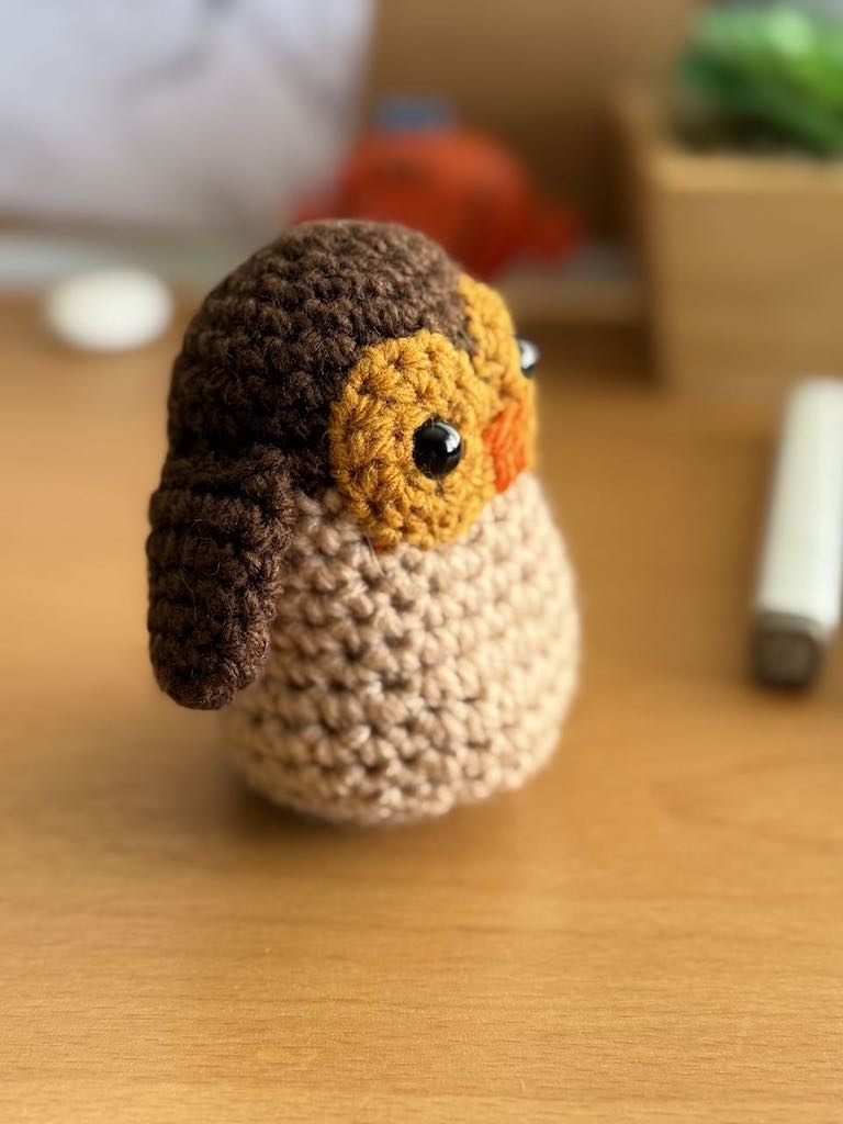 handmade crochet owl toy named Ollie with big eyes and soft feathers