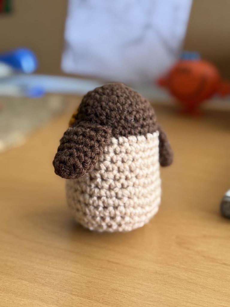 handmade crochet owl toy named Ollie with big eyes and soft feathers