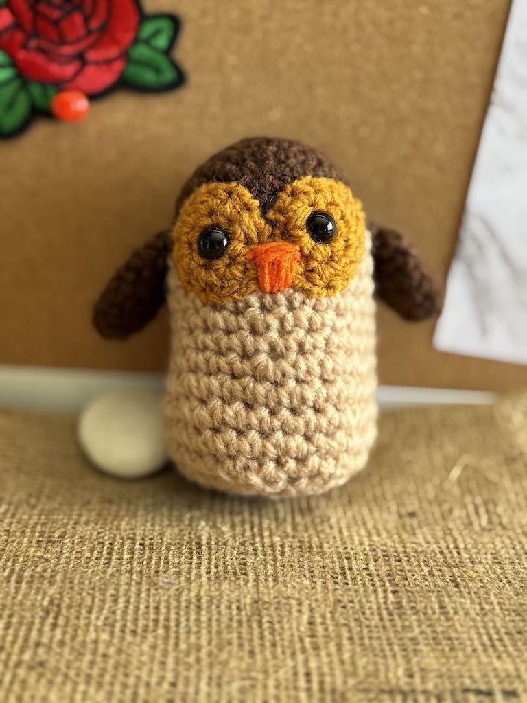 handmade crochet owl toy named Ollie with big eyes and soft feathers