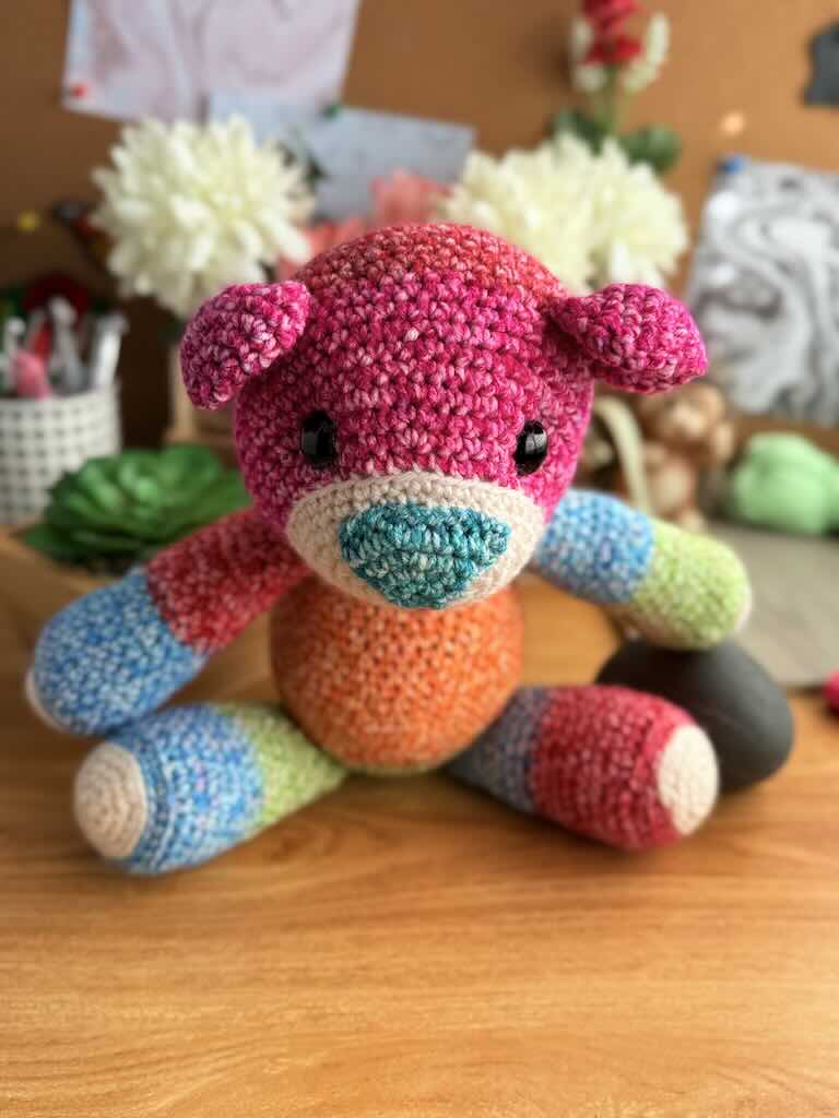 handmade crochet teddy bear named Ribbon with soft yarn and full of color
