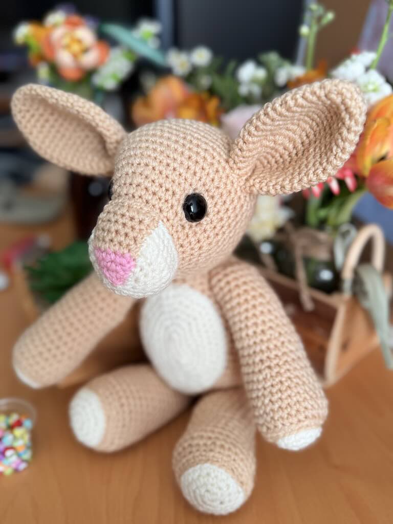 handmade crochet light-brown rabbit toy with long ears and gentle face