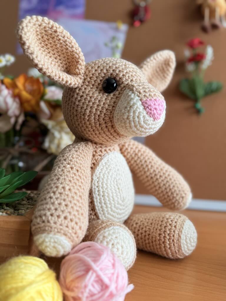 handmade crochet light-brown rabbit toy with long ears and gentle face