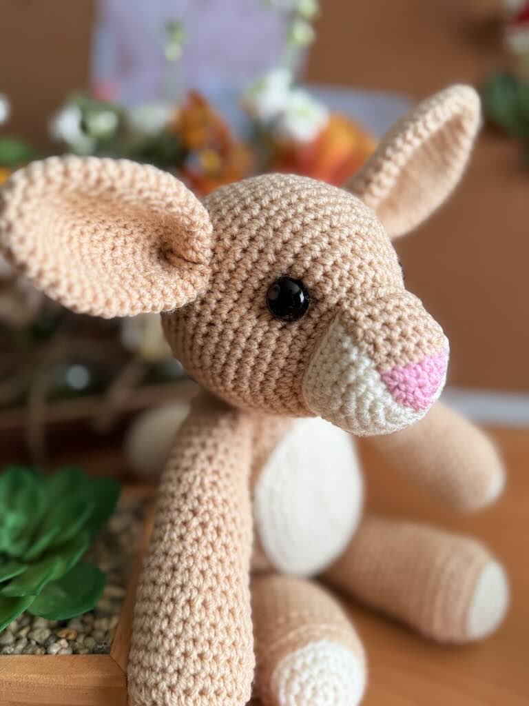 handmade crochet light-brown rabbit toy with long ears and gentle face