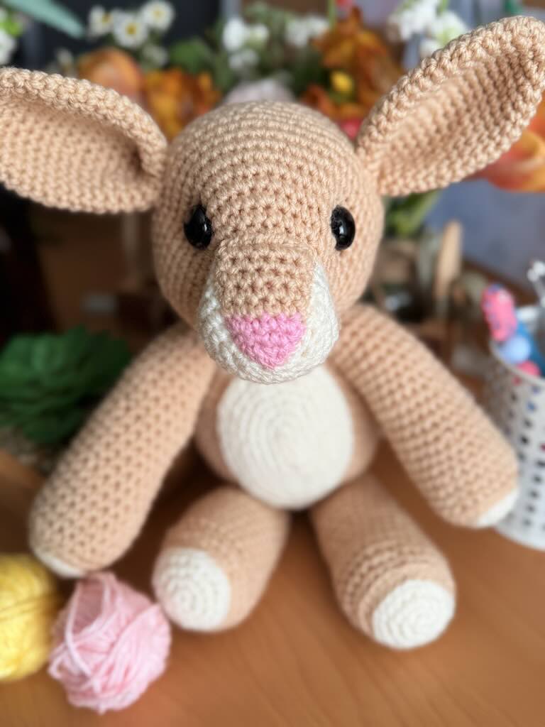 handmade crochet light-brown rabbit toy with long ears and gentle face