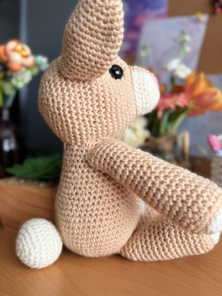 handmade crochet light-brown rabbit toy with long ears and gentle face
